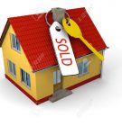 12454836-key-with-tag-saying-sold-on-small-family-house-stock-photo